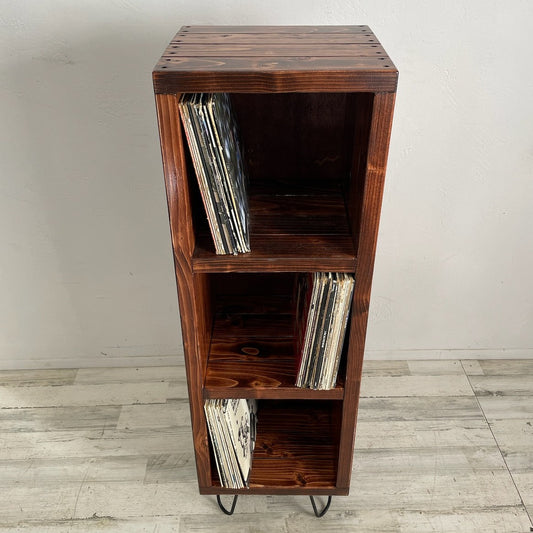 3-tier vinyl record storage cabinet with open front and vinyl records inside; dark wood