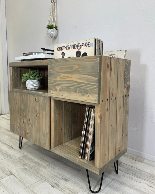 Record storage cabinet with open lower compartment, side panels, rustic wood frame