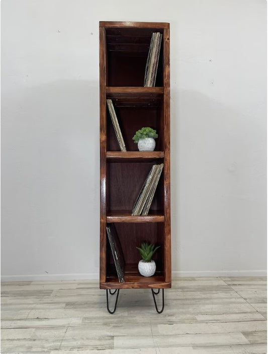 Narrow four-tier wooden vinyl record storage cabinet with stacked records