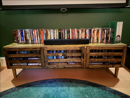 Dark wood TV stand with modern door panels, open shelves, and two drawers