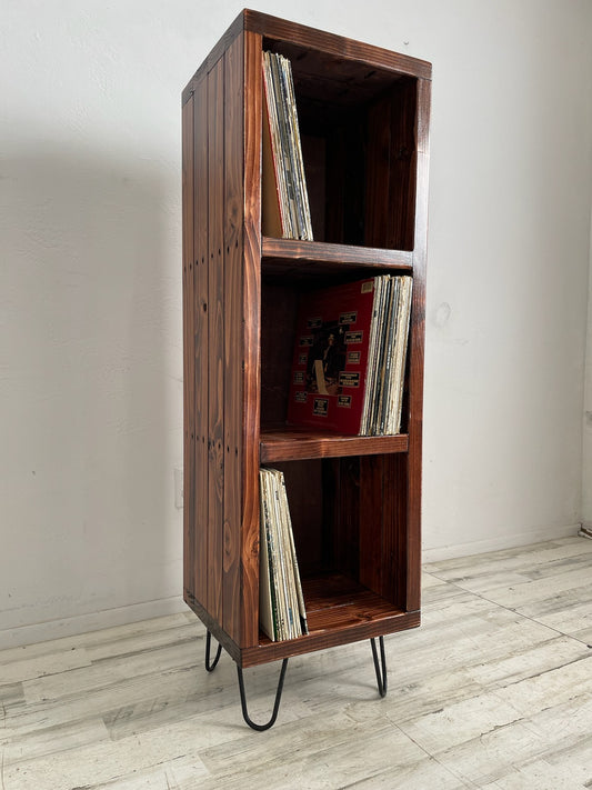 3-tier vinyl record storage cabinet with open shelves and vinyl records; dark brown wood