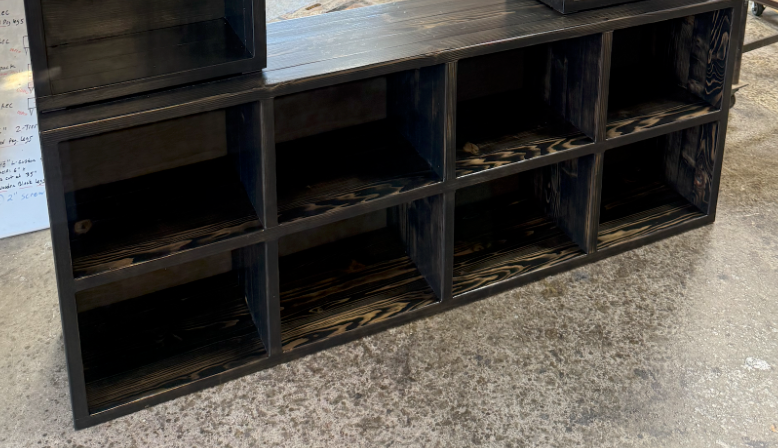 Dark stained console cabinet frame with open cubbies and square legs