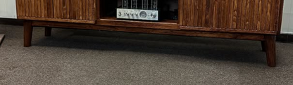 Dark stained cabinet frame base with open shelf compartments