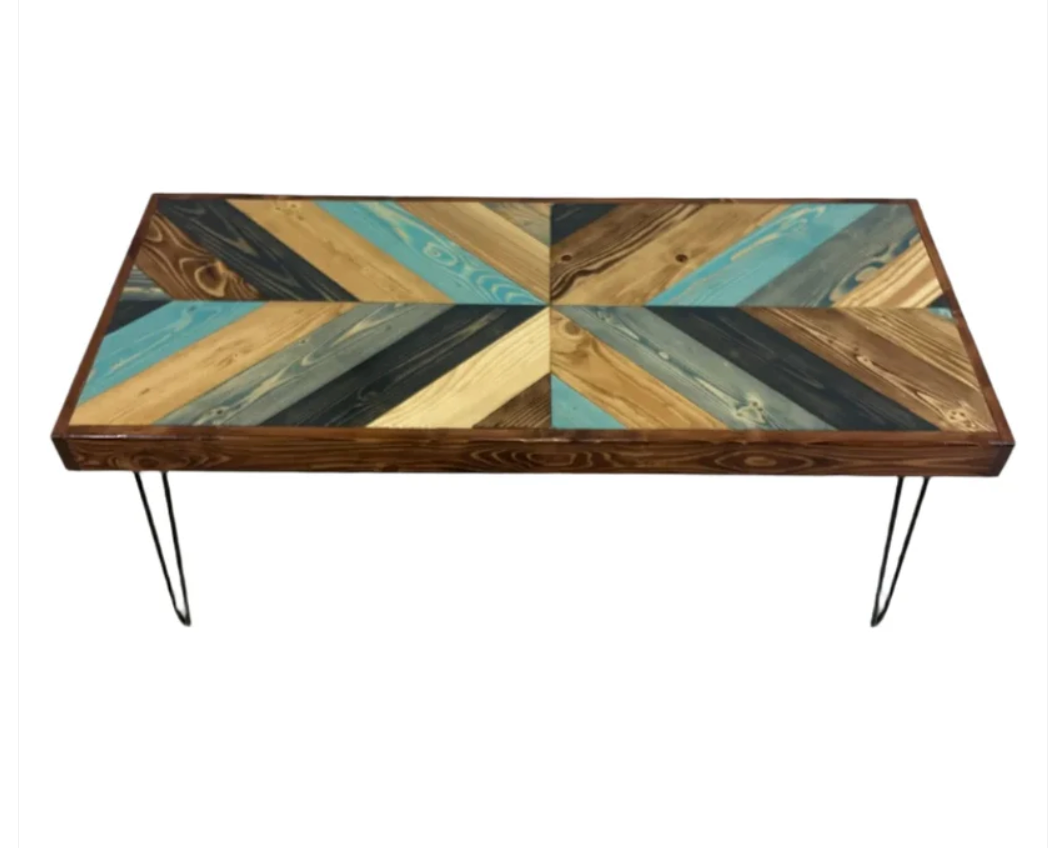 Rectangular dining table with multicolor geometric chevron top and metal hairpin legs